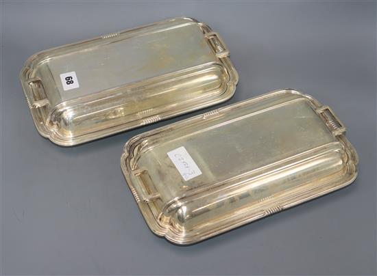 A pair of Art Deco silver plated entree dishes with covers